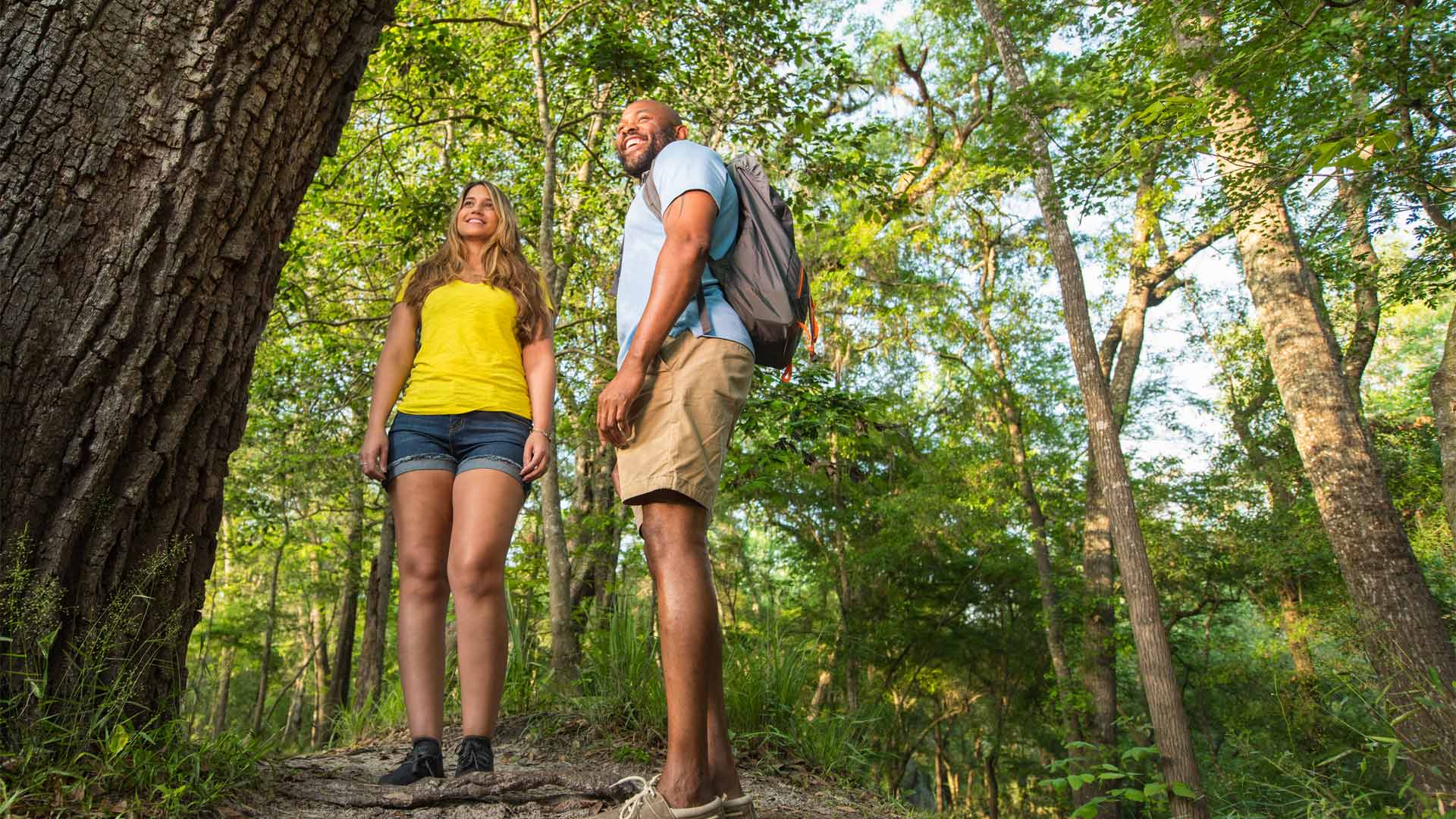 Couple smile while hiking